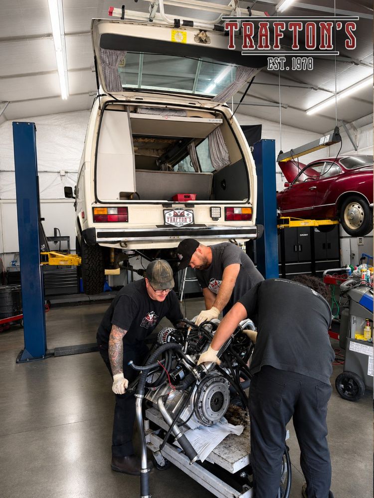 Trafton's technicians pulling the engine from an aircooled Volkswagen Westfalia camper