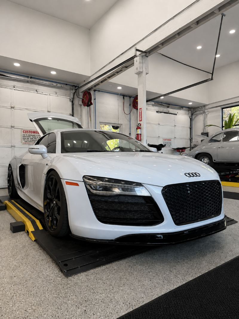 White Audi R8 V10 on the alignment rack at Trafton's Foreign Auto in Portland