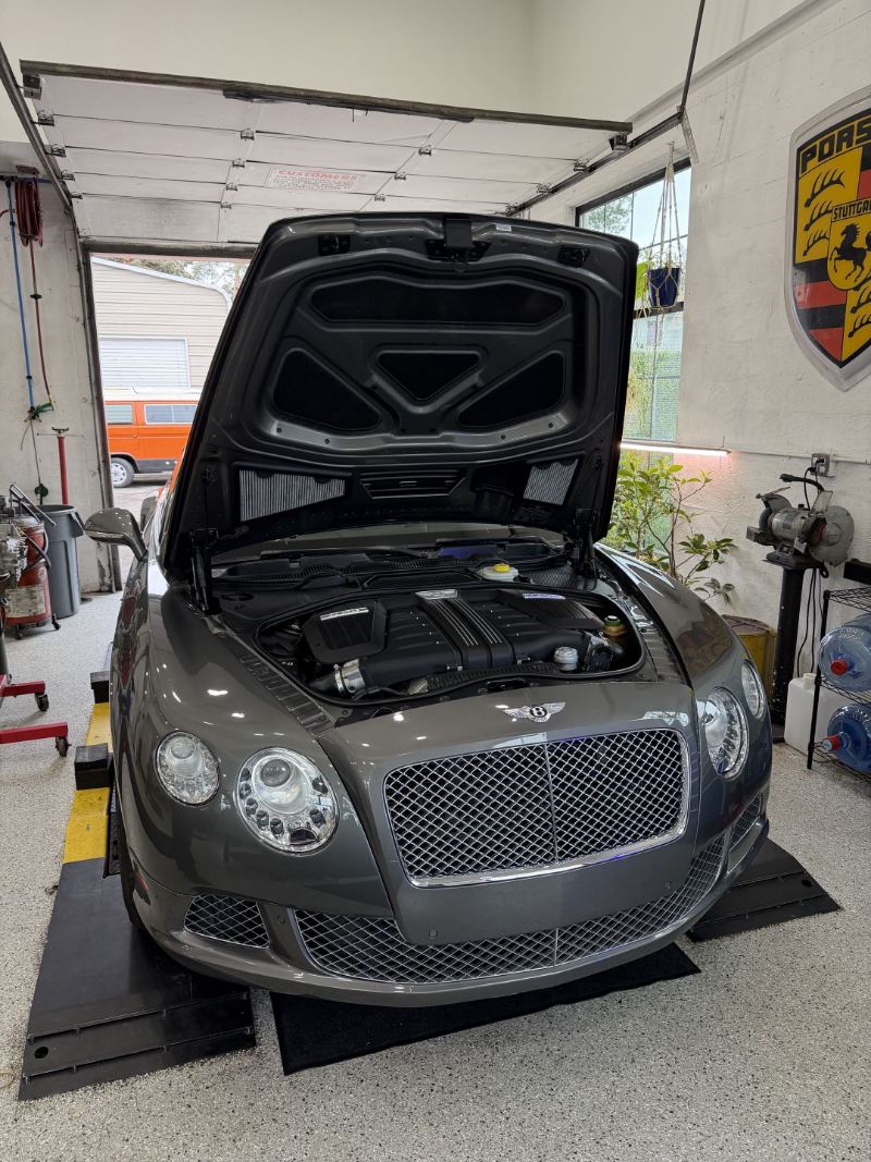 Bentley Continental GT with the hood open for service at Trafton's Foreign Auto in Portland