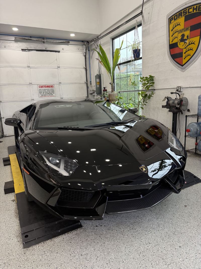 Black Lamborghini Aventador in the service bay at Trafton's Foreign Auto in Portland