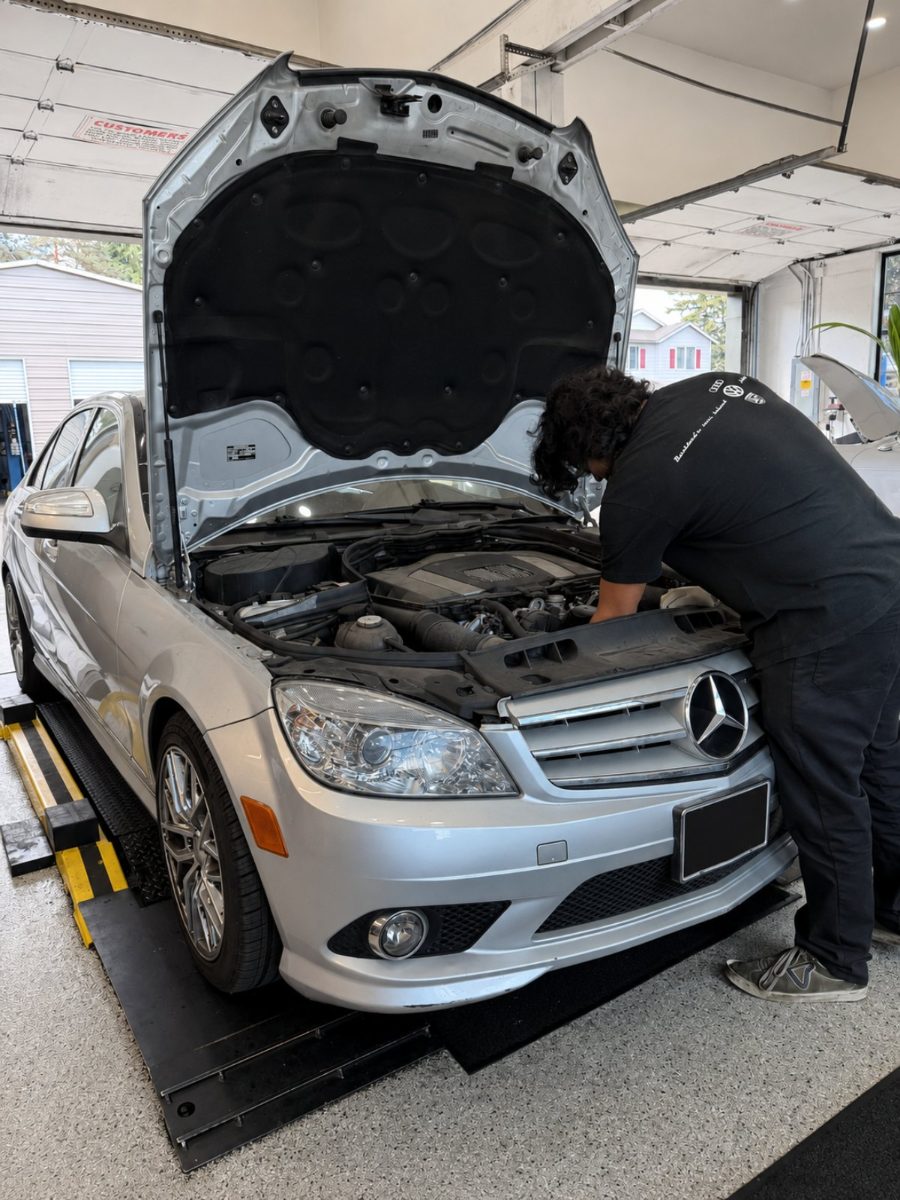 Trafton's technician servicing a silver Mercedes-Benz C-Class in Portland, Oregon